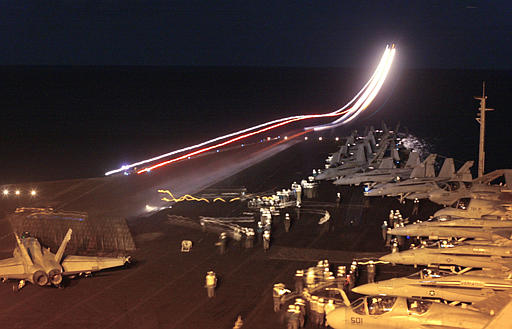 A fighter plane launches from the USS Harry S. Truman, Gulf, March 21, 2003.